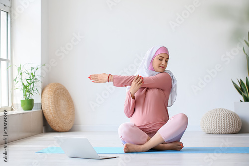 Young pregnant Muslim woman...