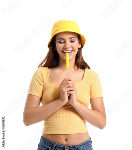 Young woman in bucket hat w...