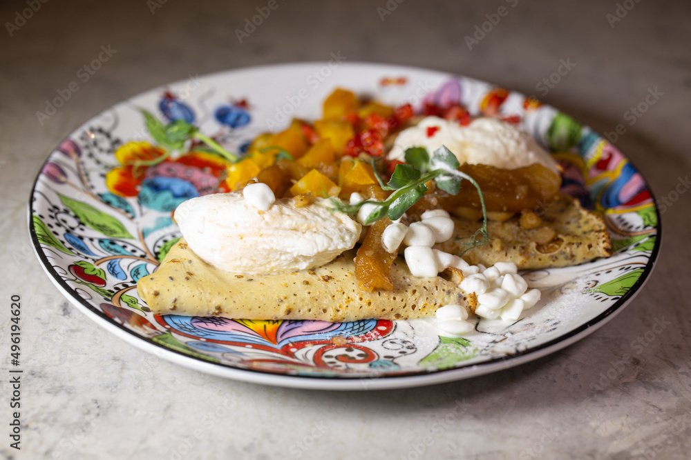 fruit filling wrapped in a pancake on a beautiful plate fruit filling wrapped in a pancake on a beautiful plate