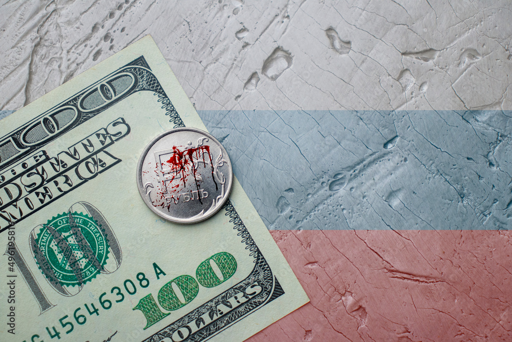 Fototapeta premium bloody Russian ruble on the dollar, the war in Ukraine, the exchange rate of the ruble, the fall of the ruble