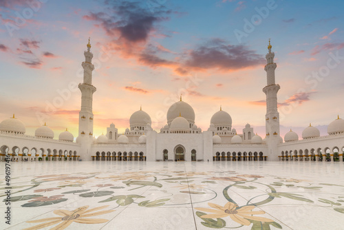 Beautiful architecture of the Grand Mosque in Abu Dhabi at sunset, United Arab Emirates photo