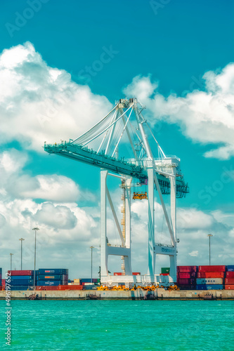 Obraz na płótnie Aerial view over cargo cranes and ships in cargo port of Miami, Florida, USA. w salonie