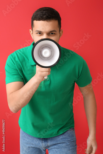 Young man shouting into meg...