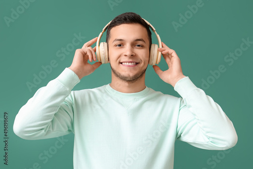 Young man in wireless headp...