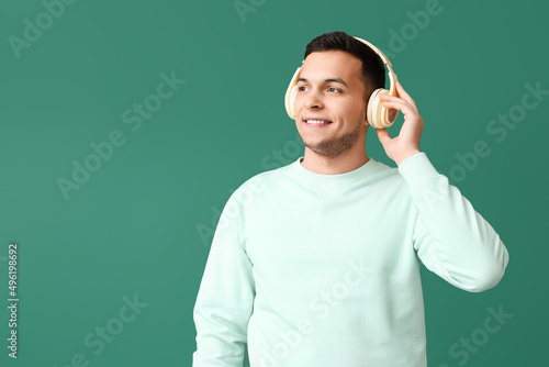 Young man in wireless headp...