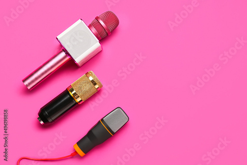 Fototapeta Naklejka Na Ścianę i Meble -  Different modern microphones on pink background