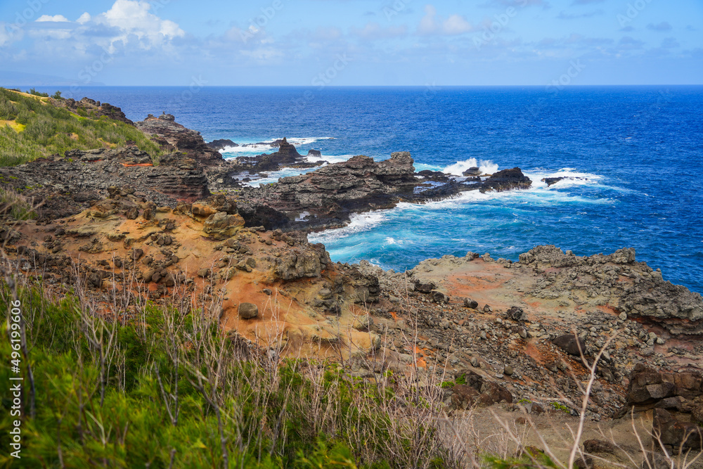 Rugged landscape on the side of the Olivine tide pools in the Pacific Ocean along the Kahekili Highway in West Maui, Hawaii, United States