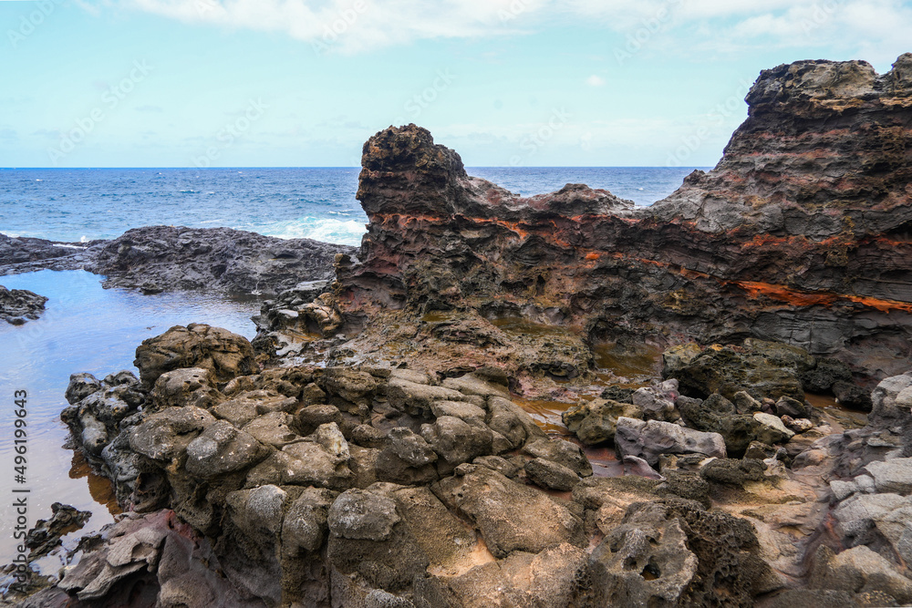 Olivine tide pools in the Pacific Ocean along the Kahekili Highway in West Maui, Hawaii, United States