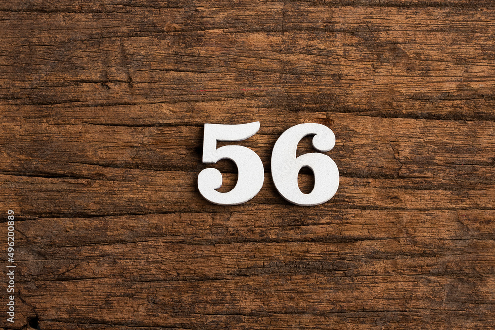 Number 56 - piece on rustic wood background Number 56 - piece on rustic wood background