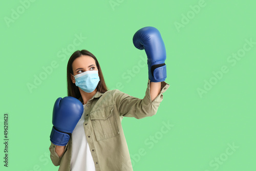 Young woman in medical mask...