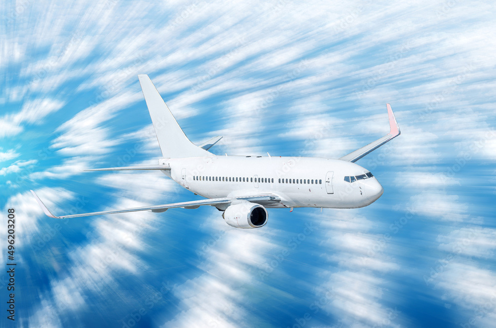 Obraz premium Airplane in the sky above the clouds flight journey sunset height speed motion blur.