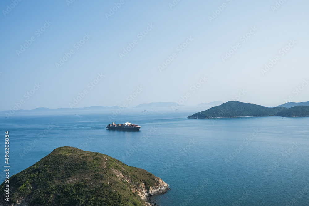 Fototapeta premium Cargo ship in ocean, Hong Kong, outdoor