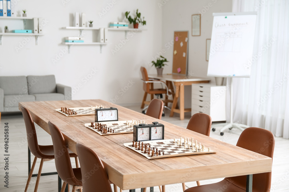 Room prepared for chess tournament in club Room prepared for chess tournament in club