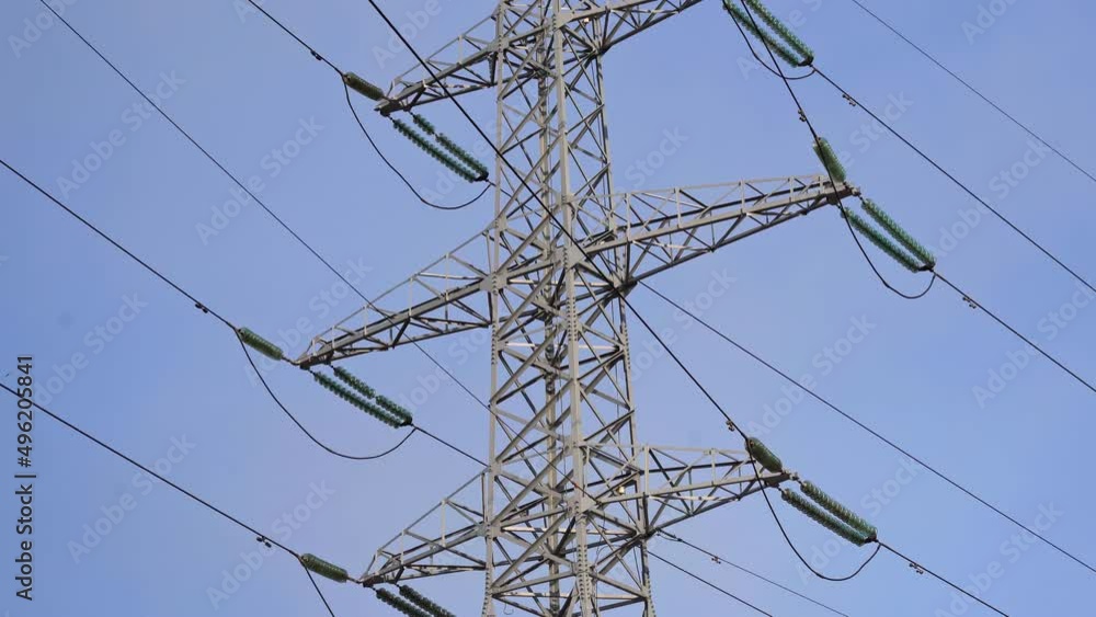 Huge Metal high-voltage tower with electric wires, the bottom view up ...