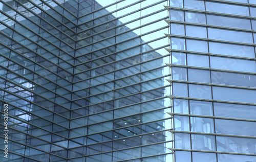 full frame modern urban office architectural abstract with geometric shapes and buildings reflected in blue glass windows