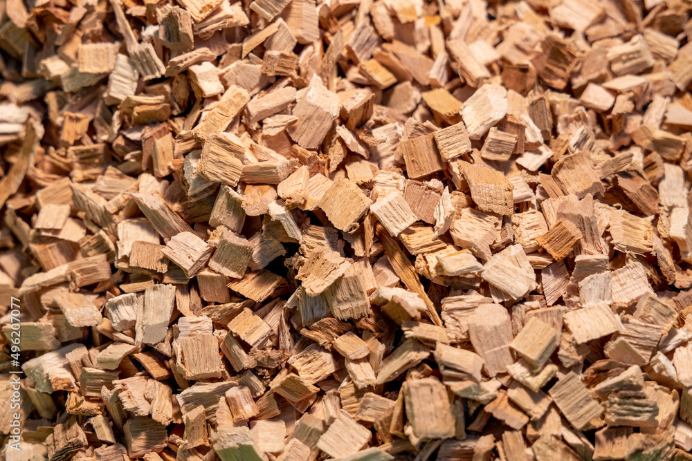 Beige wood chips for smoking. Chopped wood close-up. Wood texture or background Beige wood chips for smoking. Chopped wood close-up. Wood texture or background
