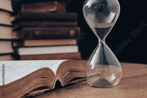 hourglass with book