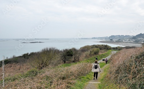 Group of senior hikers walking on a path in Brittany. France