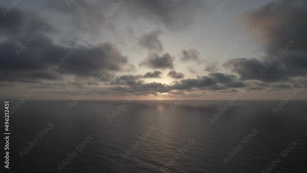 Sunrise over the sea. Epic view of the ocean and reflection of clouds and sun. Sunrise over the sea. Epic view of the ocean and reflection of clouds and sun.