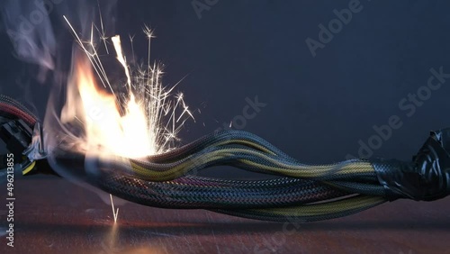 The wiring is burning and sparking on a dark 
