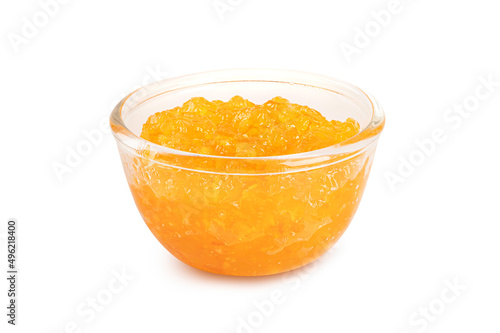 Orange jam in glass bowl isolated on white background.