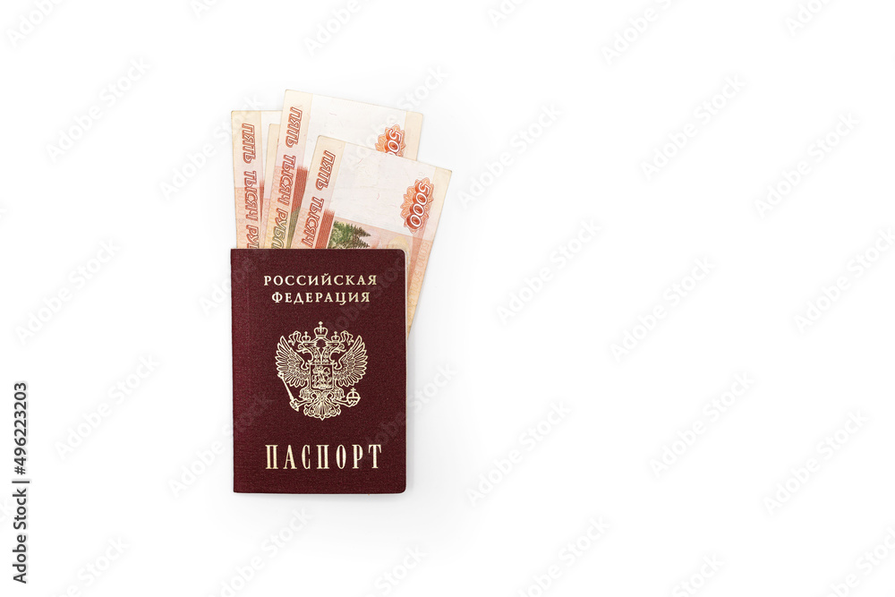 Fototapeta premium Russian passport with banknotes of 5000 rubles on a white background
