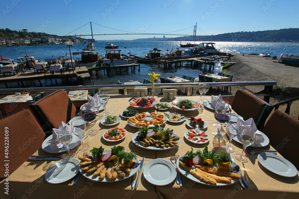 Turkish sea foods and Turkish appetizer foods on the restaurant table at Bosphorus in Istanbul, Turkey.