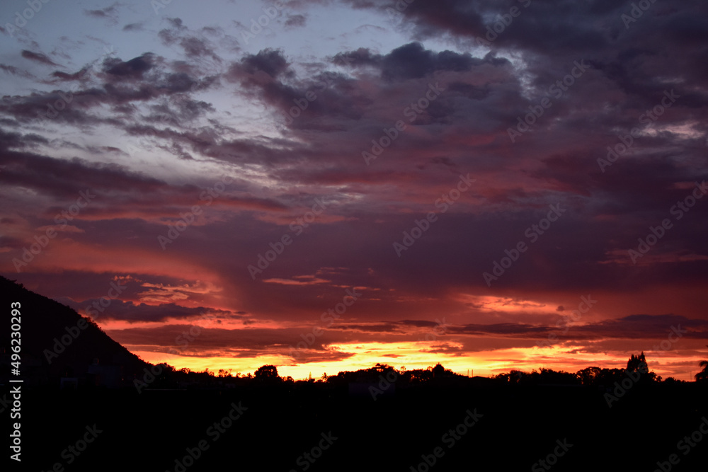sunset and colorful clouds, sky and clouds in shades of purple, red, lilac, aquamarine.