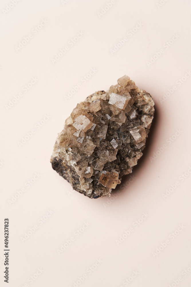 Crystal stone on pink background with copy space Crystal stone on pink background with copy space