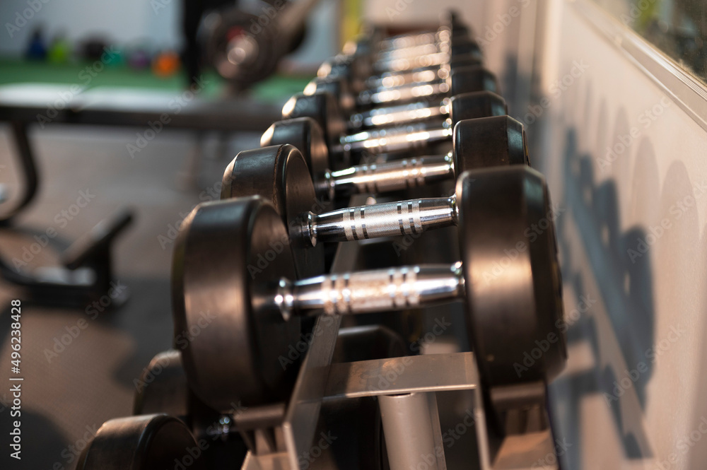 Naklejka premium Heavy barbells on the floor of the gym studio copyspace bodybuilding weightlifting fitness power strength endurance agility exercise exercise