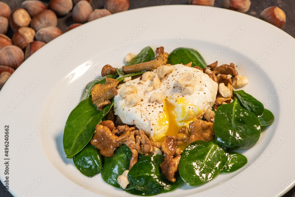 Recipe for poached egg with black tea cut with a knife, warm salad of chanterelles, High quality photo Recipe for poached egg with black tea cut with a knife, warm salad of chanterelles, High quality photo