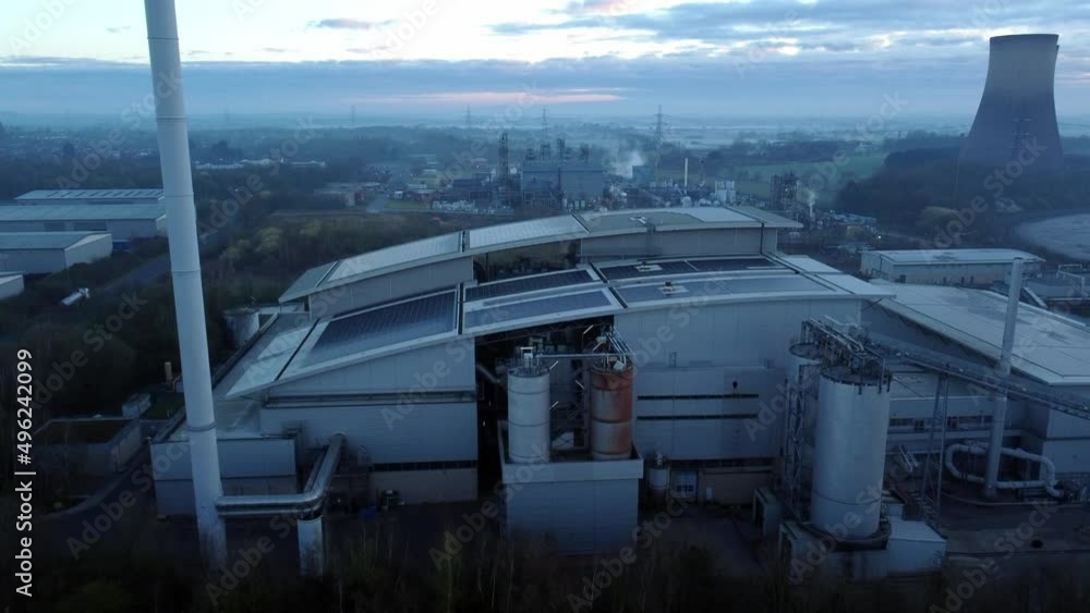 Futuristic solar green energy factory rooftop on foggy rural countryside morning aerial view rising close up Futuristic solar green energy factory rooftop on foggy rural countryside morning aerial view rising close up