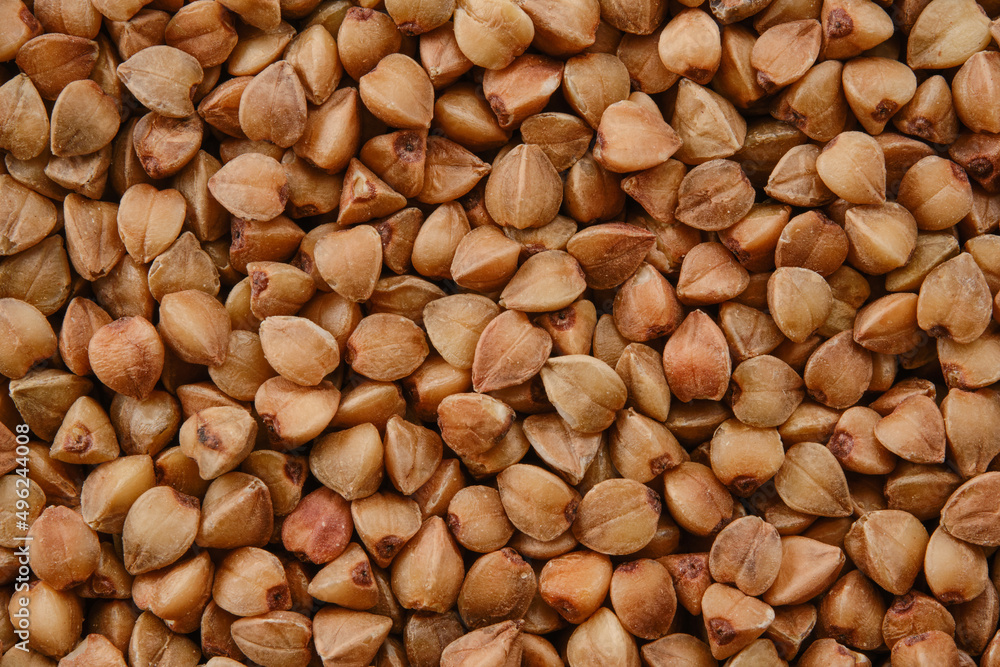 Background of buckwheat groats. Background of buckwheat seed. Background of buckwheat groats. Background of buckwheat seed.
