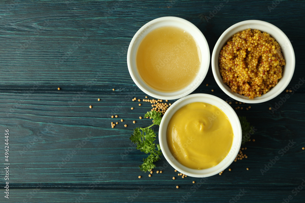 Bowls with sauces on wooden table, space for text Bowls with sauces on wooden table, space for text