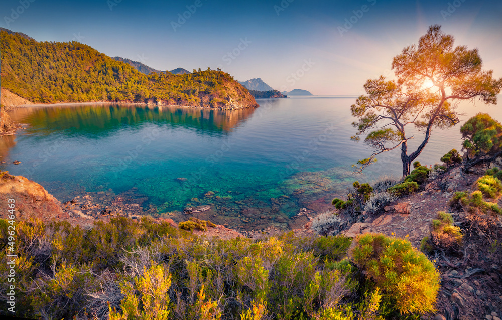 Stunning Mediterranean seascape in Turkey. Amazing sunrise in small bay in outskirts of Tekirova village, District of Kemer, Antalya Province. Beauty of nature concept background..