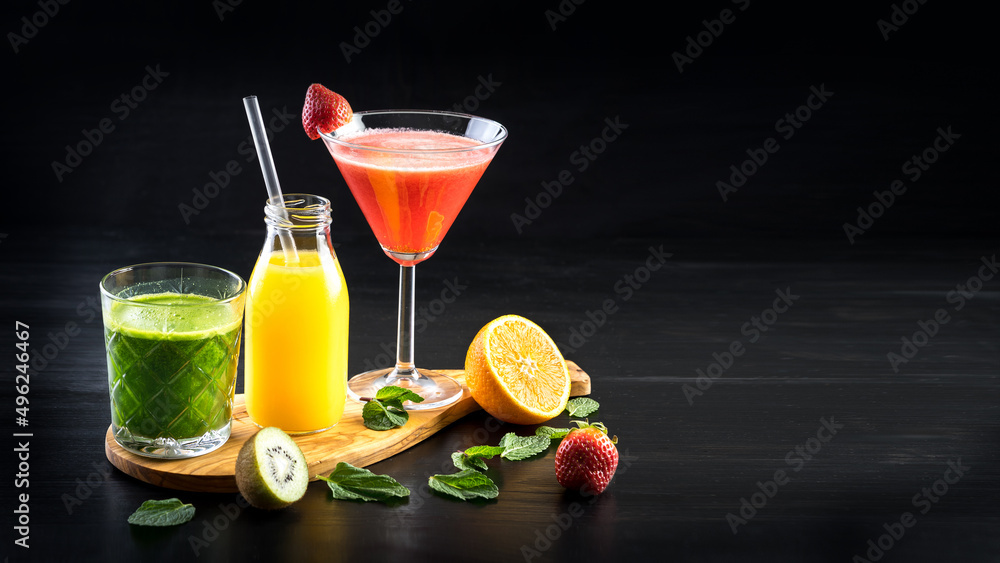 wide photo of fresh squeezed fruit juice selection with space for text
