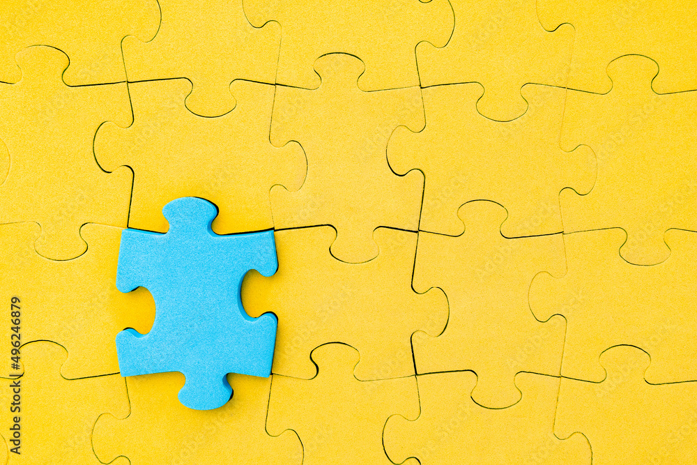 Blue jigsaw puzzle piece stands out from the crowd Blue jigsaw puzzle piece stands out from the crowd