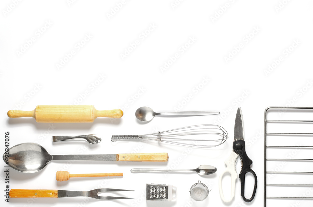 Fototapeta premium Wooden and metal kitchen utensils. Tools for cooking. White background. Flat lay