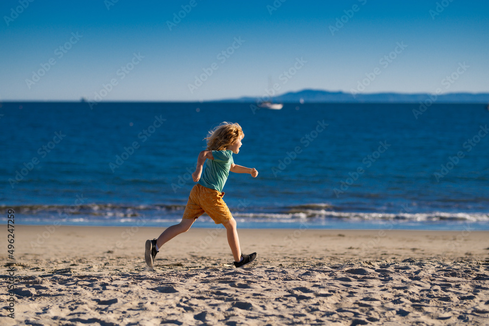 Kids running outdoors. Run and healthy sport for children. Child running on summer near sea, kids fitness.