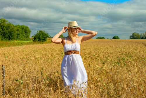 Wallpaper Mural young beautiful woman in a wheat field Torontodigital.ca