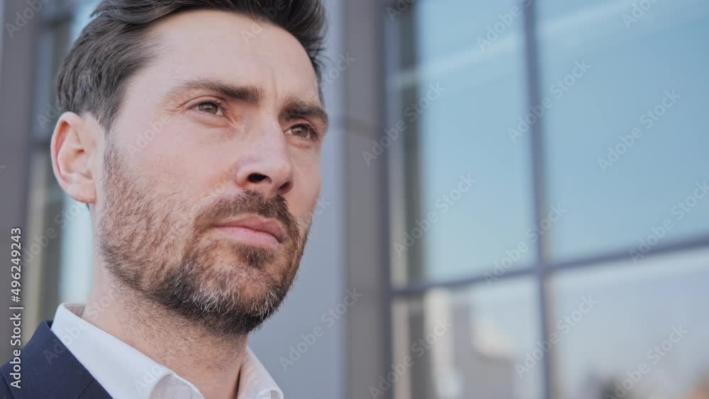 Close up view of handsome male businessman is looking thoughtfully thinking. Male entrepreneur is opening his eyes. Portrait of a thoughtful business man Concept of successful people, faces, human. Close up view of handsome male businessman is looking thoughtfully thinking. Male entrepreneur is opening his eyes. Portrait of a thoughtful business man Concept of successful people, faces, human.