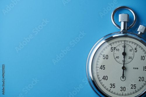 Close up stopwatch against blue background