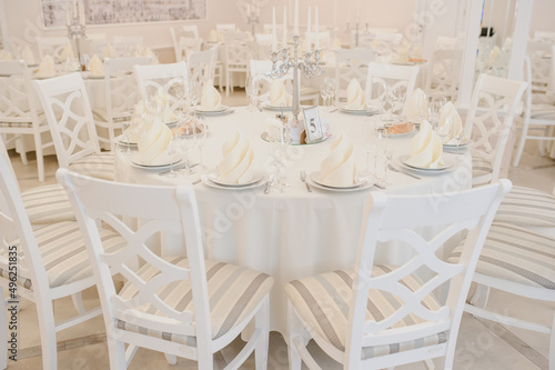 Close up arranged table with plates and glasses on a wedding