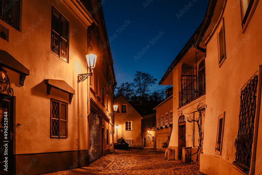 Quarter called New World in Prague consists of winding streets and small picturesque houses dating back to Middle Ages.Charming place with romantic atmosphere.Evening city,illuminated buildings