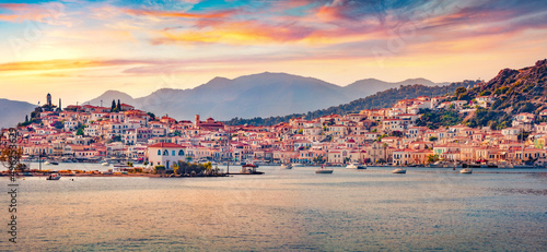 Fototapeta Naklejka Na Ścianę i Meble -  Panoramic morning cityscape of Poros town, Greece, Europe. Stunning summer sunrise on Myrtoan Sea. Traveling concept background.