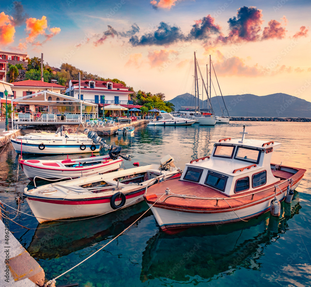 Boats and yachts on Vathi port. Exciting morning scene of Peloponnese peninsula, Greece, Europe. Wonderful Ioninan seascape. Traveling concept background.