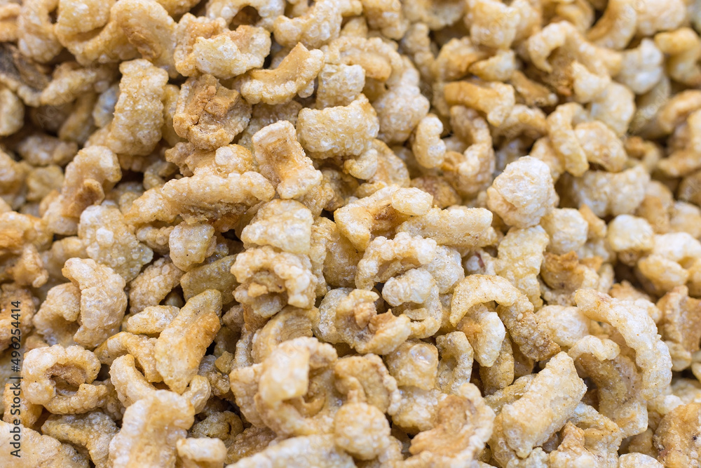 Pork crackling (pork snack, pork scratching) is fried pork skin as snack and we can eat it with noodles in Thai food style. Pork crackling (pork snack, pork scratching) is fried pork skin as snack and we can eat it with noodles in Thai food style.