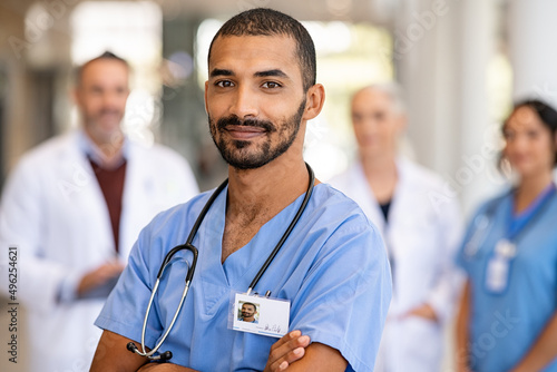 Young confident male nurse looking at camera