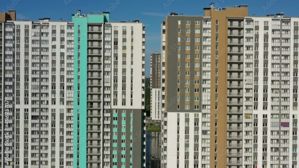 Aerial view of new apartment buildings complex and residential houses neighborhood, 4k