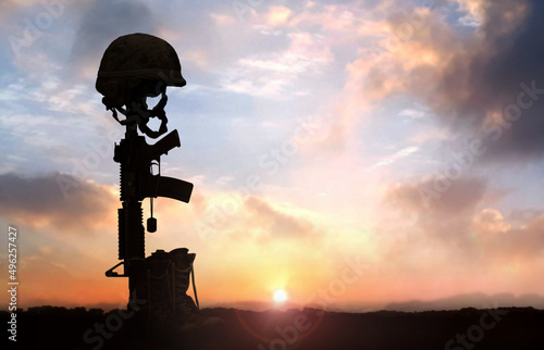 Photography Fallen Soldier background concept with military helmet boots and rifle